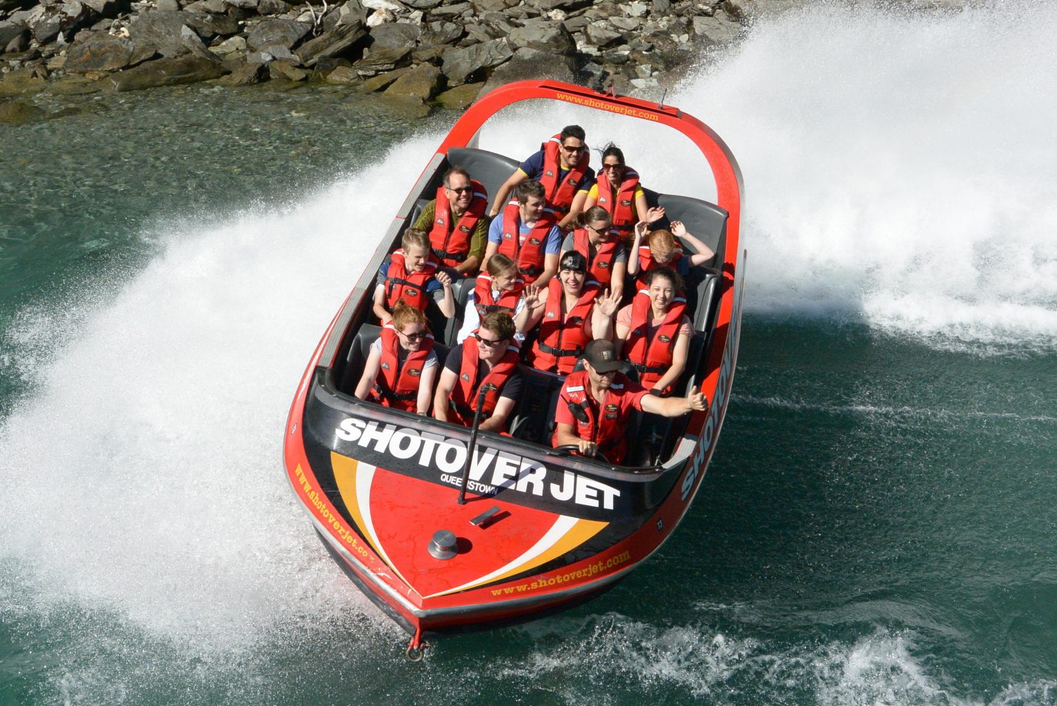Craze family in the second and third rows of the jet boat during one of its 360 degree spins.